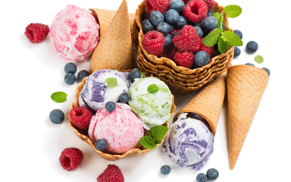 A vibrant 4K Ultra HD wallpaper featuring colorful scoops of berry-flavored ice cream in waffle cones alongside fresh blueberries and raspberries.