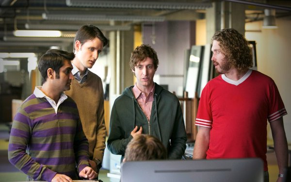 HD desktop wallpaper featuring a group of individuals in a collaborative setting, evoking the spirit of Silicon Valley.