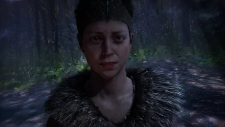 Senua from the video game Hellblade: Senua's Sacrifice — close-up portrait in a rain-soaked dark forest, 4K Ultra HD PC desktop wallpaper and background.