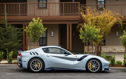 Silver Ferrari F12berlinetta supercar grand tourer parked by a townhouse — sleek silver car vehicle, HD PC desktop wallpaper.