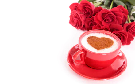 A romantic HD desktop wallpaper featuring a heart-shaped cappuccino in a red cup and saucer, accompanied by a bouquet of red roses in the background.