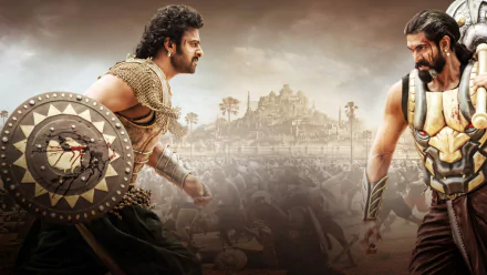 HD wallpaper from the movie Baahubali 2: The Conclusion, featuring two warriors facing off with a battle and ancient city in the background.