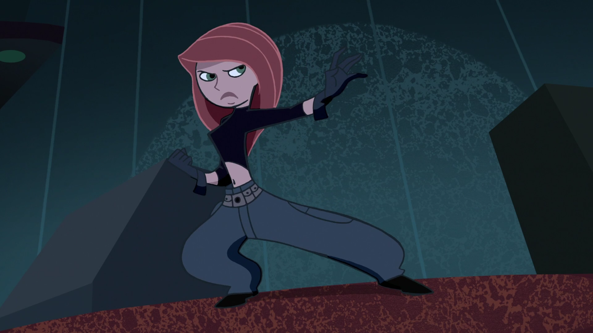 Kim Possible from the TV show in a crouched fighting pose on a rooftop against a dark city backdrop — HD PC desktop wallpaper.