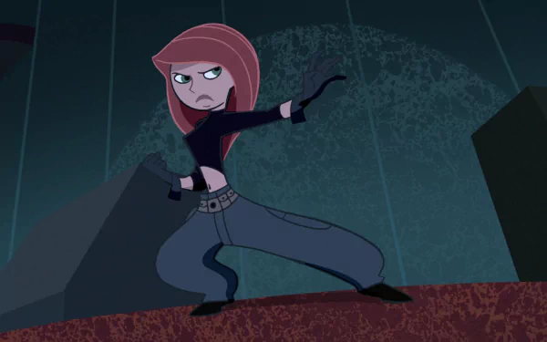 Kim Possible from the TV show in a crouched fighting pose on a rooftop against a dark city backdrop — HD PC desktop wallpaper.