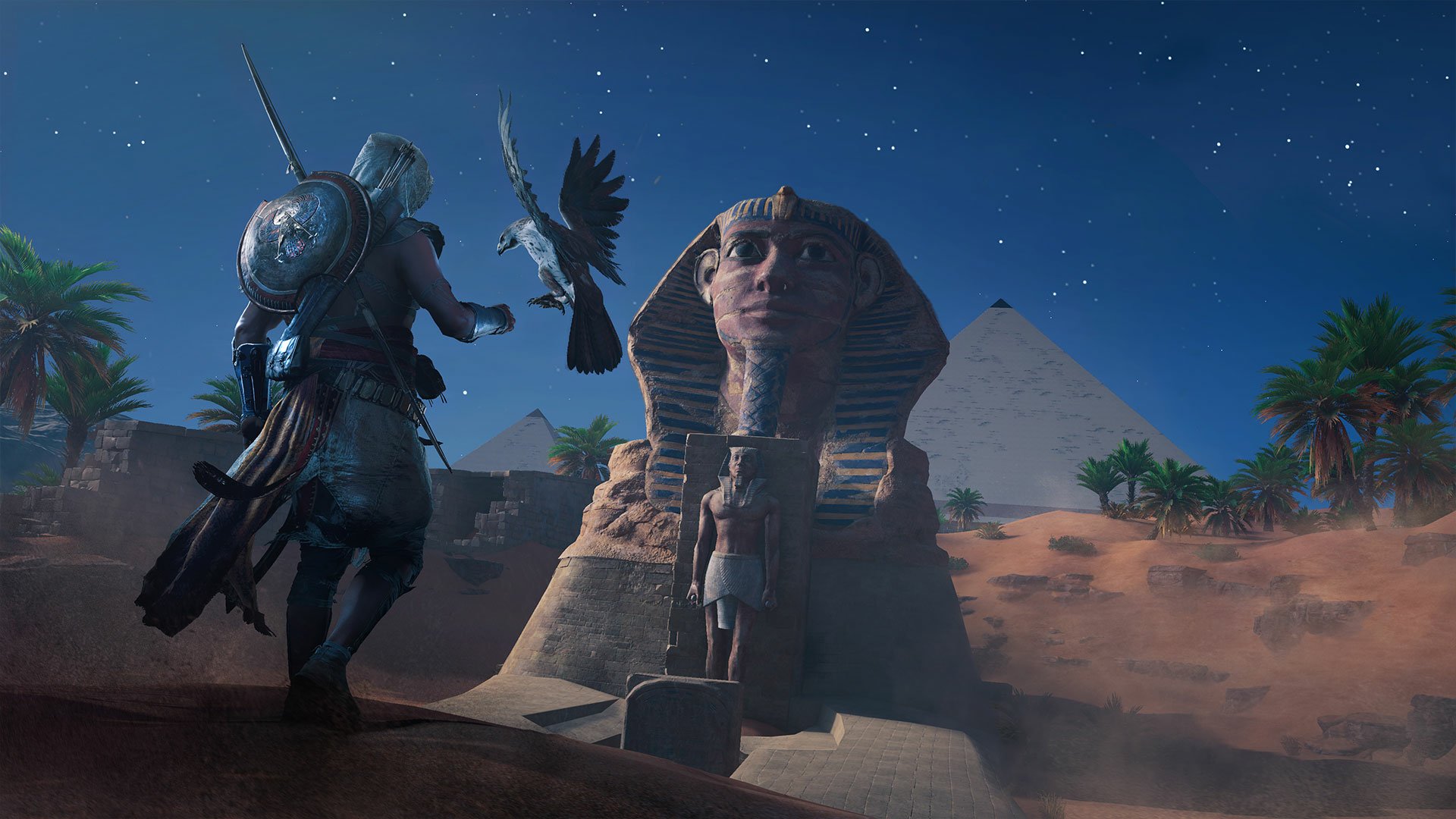 HD PC desktop wallpaper featuring Bayek of Siwa and his eagle Senu from Assassin's Creed Origins, set against the Great Sphinx and pyramids under a starry night sky.