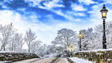 Artistic HD desktop wallpaper of a snowy winter scene featuring a stone bridge, street lights, and gentle snowfall under a bright blue sky.