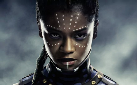 HD desktop wallpaper featuring Letitia Wright as Shuri from Marvel's Black Panther movie, showcasing her intense gaze and tribal face paint, against a dramatic background.