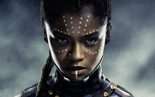 HD desktop wallpaper featuring Letitia Wright as Shuri from Marvel's Black Panther movie, showcasing her intense gaze and tribal face paint, against a dramatic background.
