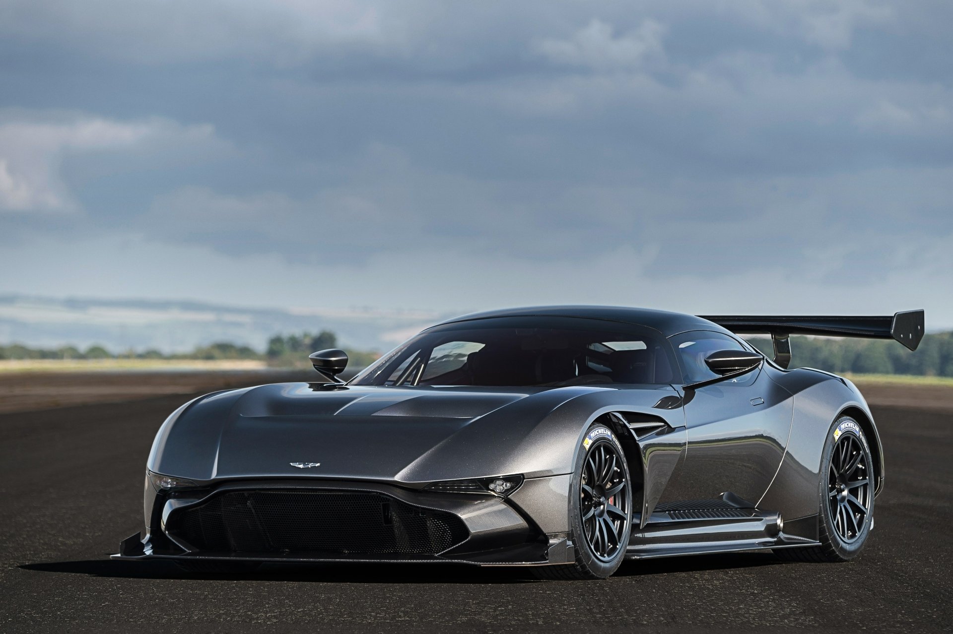 A sleek Aston Martin Vulcan race car, a high-performance supercar, showcased in stunning 4K Ultra HD as a PC desktop wallpaper background.
