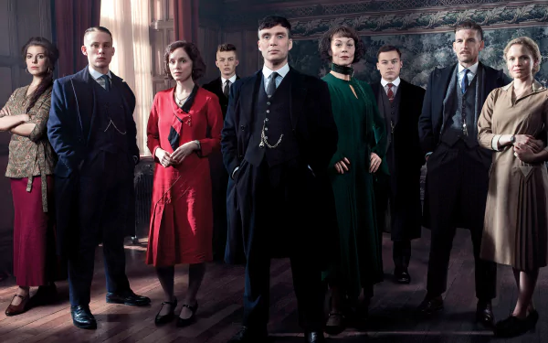 HD desktop wallpaper featuring the main cast of the TV show Peaky Blinders with Cillian Murphy as Thomas Shelby, standing together in period costumes.