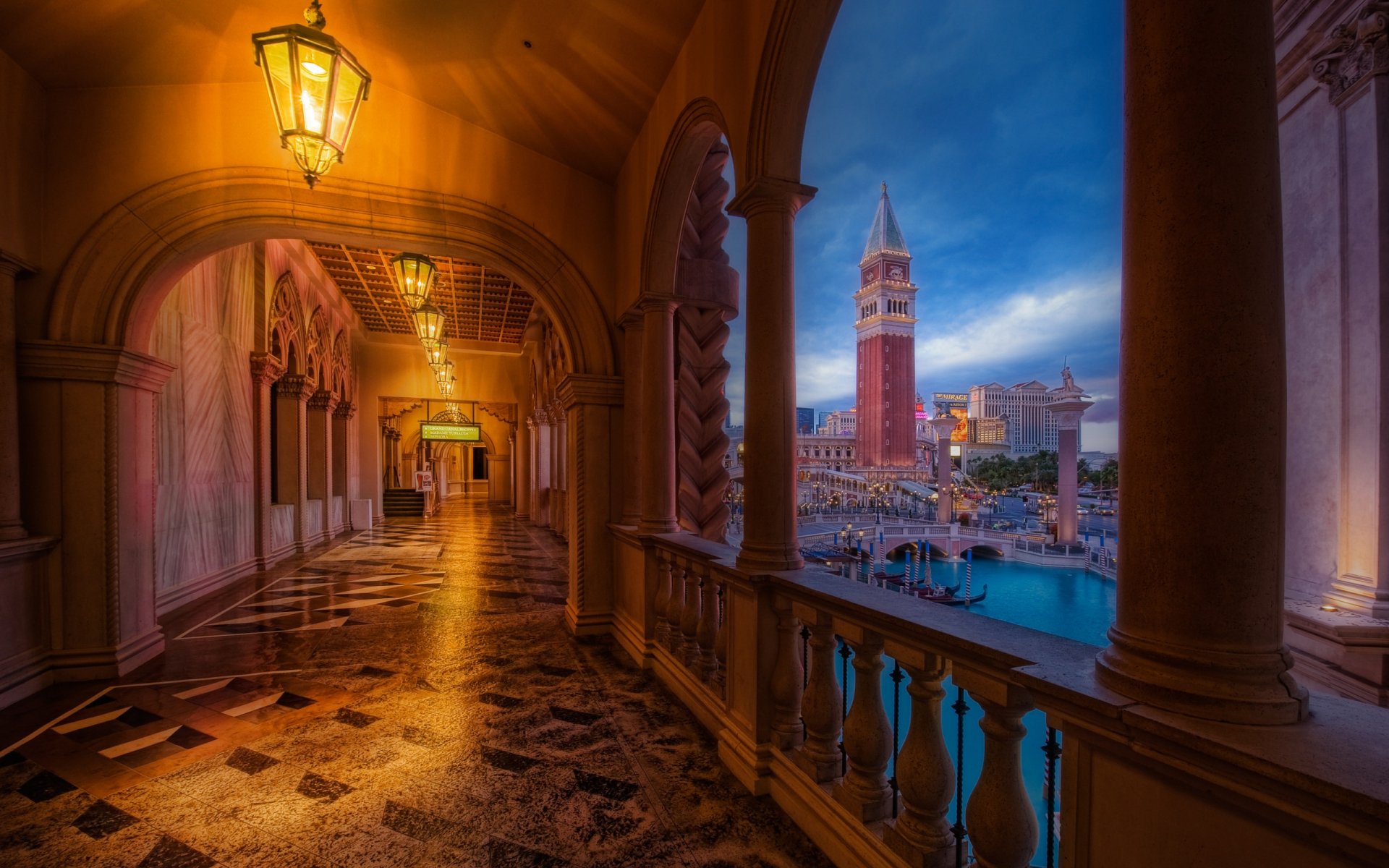 A stunning HD wallpaper showcasing an elegant hallway adorned with arches and lanterns, offering a picturesque view of a bell tower against a twilight sky.