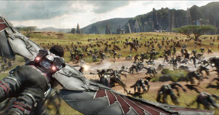 Falcon, played by Anthony Mackie, soars through a battlefield in a dramatic scene from Avengers: Infinity War, showcasing the Hulkbuster and chaos surrounding him. Outriders swarm the landscape.