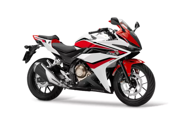 Sleek red and white Honda CBR500R motorcycle showcased in sharp 4K Ultra HD against a clean background, highlighting its sporty design and dynamic curves.