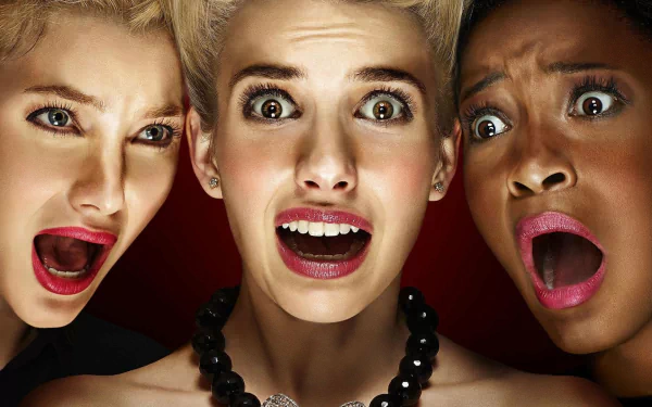 HD PC desktop wallpaper featuring close-up of three shocked women from the TV show Scream Queens, showcasing intense expressions against a dark background.