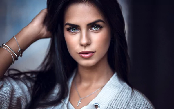 HD desktop wallpaper featuring Marlen Valderrama Alvaréz with striking green eyes, black hair, and subtle lipstick, showcasing a confident, poised expression.