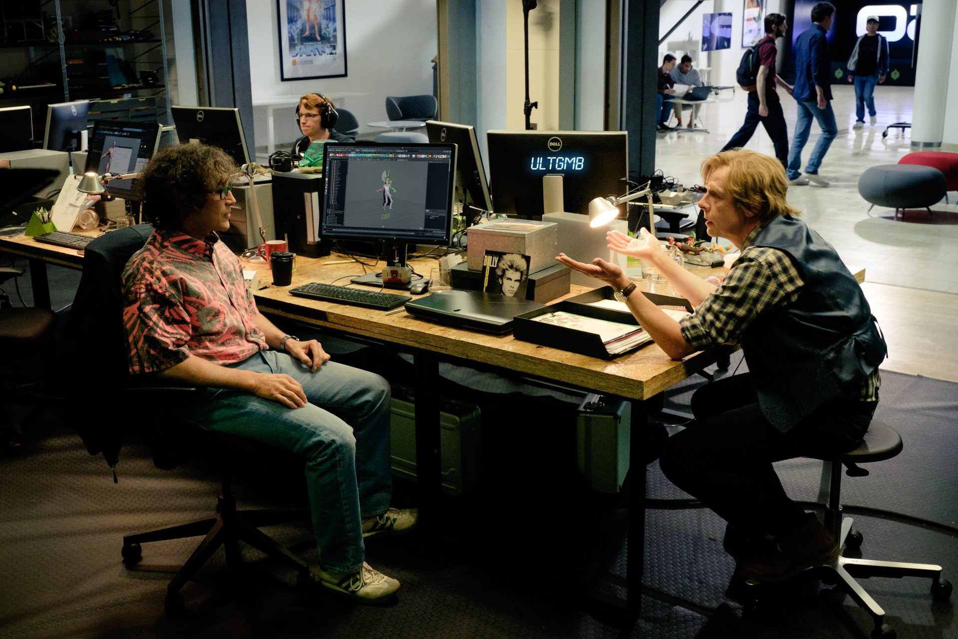 Two men in a cluttered tech workspace compare vintage electronics, cinematic scene from the Ready Player One movie, 4K Ultra HD PC desktop wallpaper.