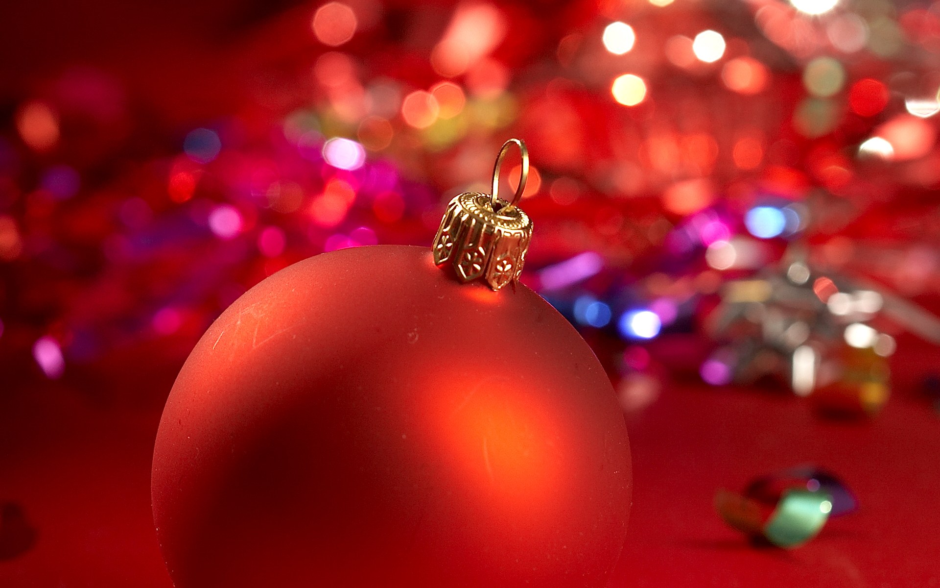 Christmas ornaments on a holiday-themed desktop wallpaper.