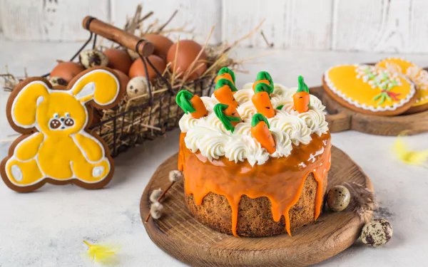 A vibrant 4K Ultra HD still life desktop wallpaper featuring a carrot cake topped with cream and small carrot decorations, alongside an egg and bunny-shaped pastry on a rustic table.