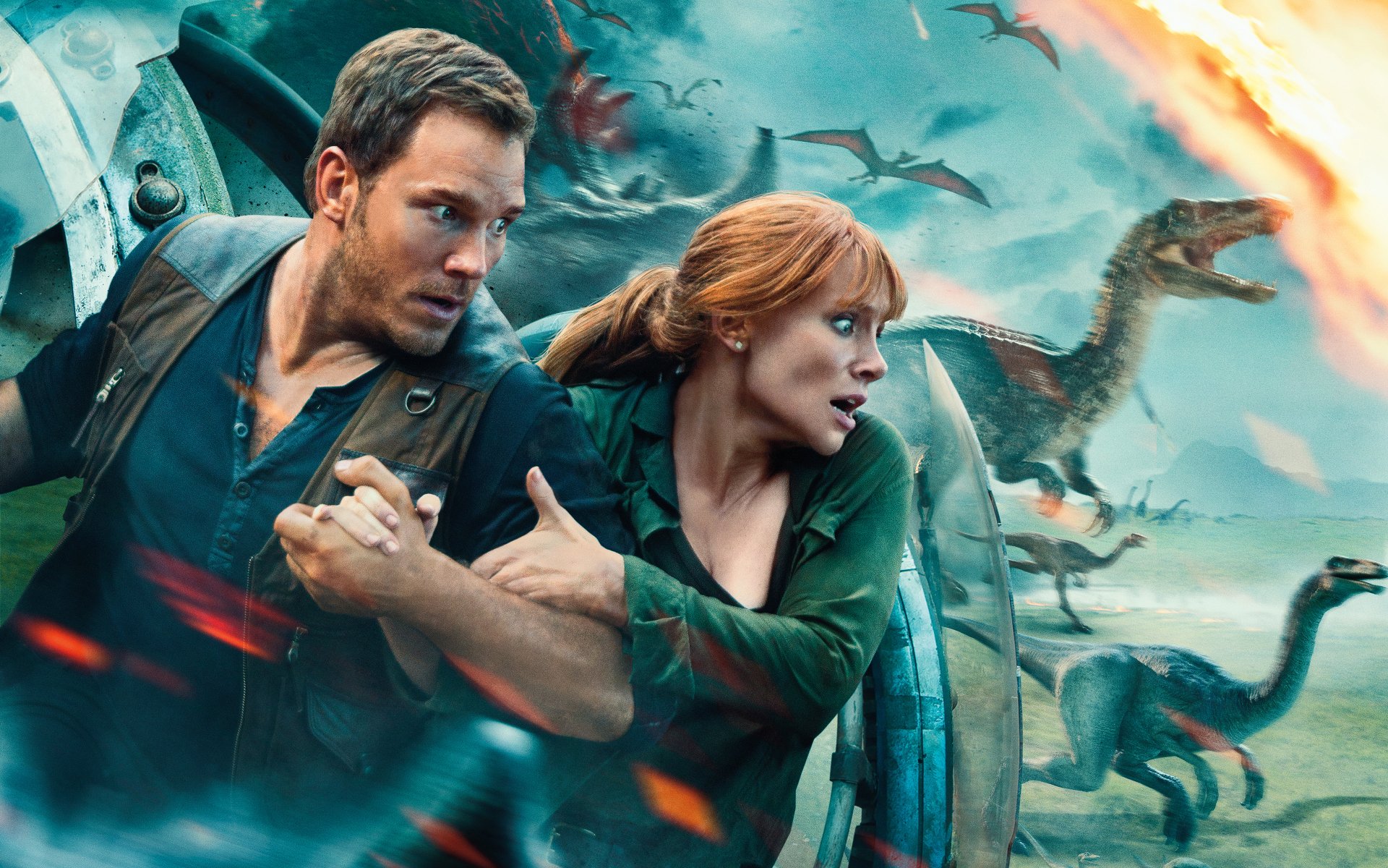 Bryce Dallas Howard and Chris Pratt in an intense scene from Jurassic World: Fallen Kingdom, featured in a 4K Ultra HD PC desktop wallpaper.