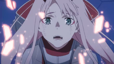HD desktop wallpaper featuring Zero Two from Darling in the FranXX anime, showing an emotional moment with a close-up of her face amidst glowing fragments.