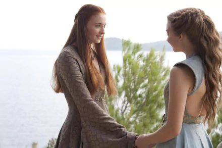 Natalie Dormer as Margaery Tyrell and Sophie Turner as Sansa Stark share a moment in Game of Thrones, captured in an HD desktop wallpaper.
