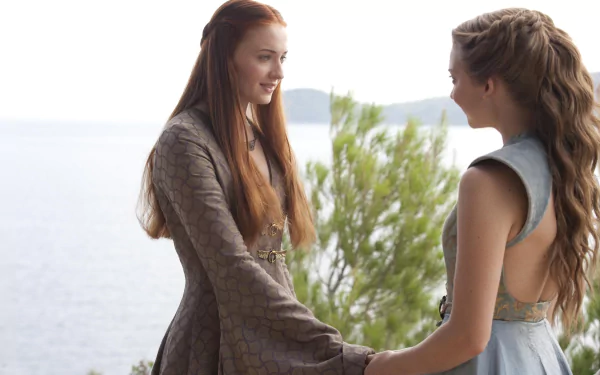 Natalie Dormer as Margaery Tyrell and Sophie Turner as Sansa Stark share a moment in Game of Thrones, captured in an HD desktop wallpaper.