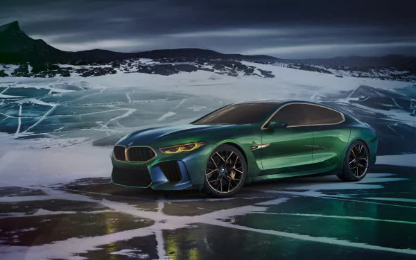 A sleek green BMW M8 Gran Coupe concept car is displayed on a striking icy landscape, highlighted in vibrant colors, serving as a stunning 4K Ultra HD desktop wallpaper.