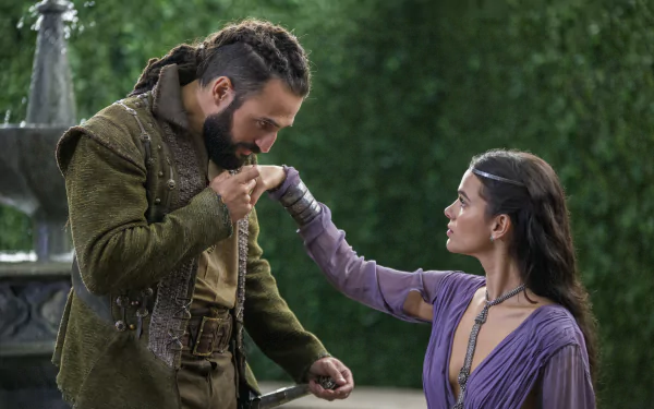 HD desktop wallpaper from Deus Salve o Rei featuring two characters in a medieval setting, one kneeling and holding the other's hand.