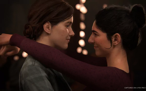 Ellie and Dina from The Last of Us Part II stand closely, sharing a tender moment. This HD desktop wallpaper showcases the characters' intimate connection, set against a backdrop of soft, warm lights.