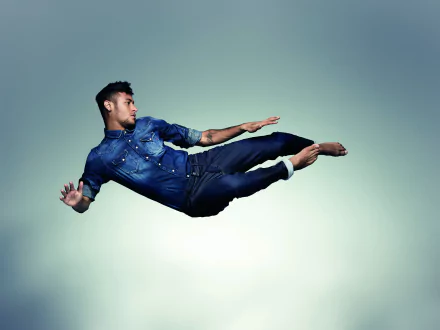 Brazilian soccer star Neymar captured mid-air against a minimalist background, featured in a 4K Ultra HD PC desktop wallpaper showcasing his dynamic athleticism.