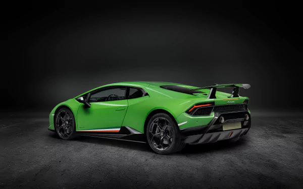 8K Ultra HD desktop wallpaper of a green Lamborghini Huracan Performante supercar, rear three-quarter view of the car on a dark studio background, showcasing the high-performance vehicle.