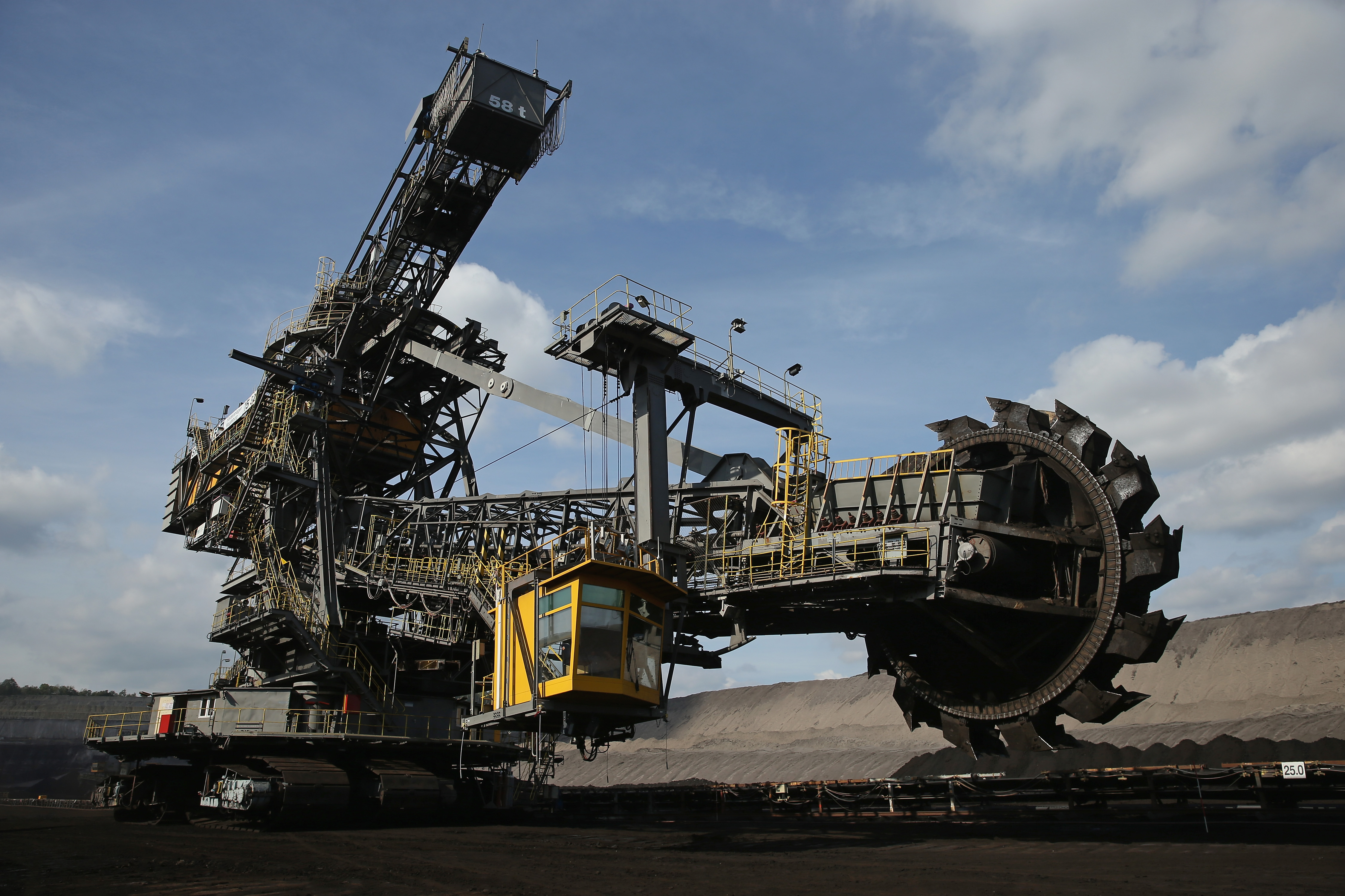 A bucket wheel excavator moves into position in an open-pit lignite coal mine by Sean Gallup