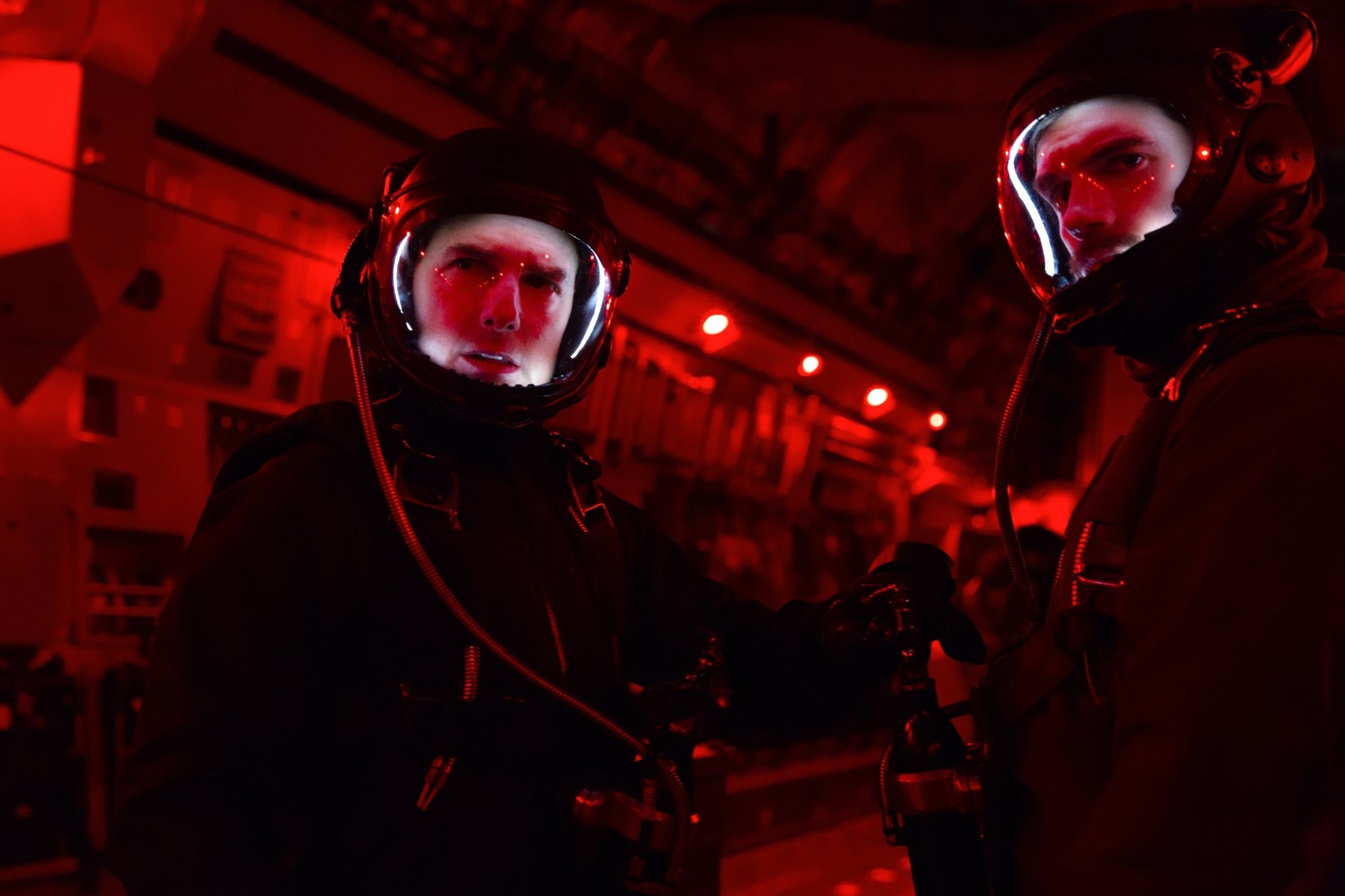 Two helmeted operatives in a red-lit aircraft interior — cinematic 5K PC desktop wallpaper, Mission: Impossible - Fallout.