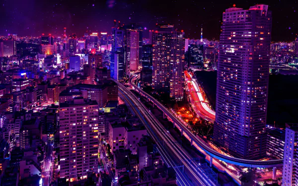 Nighttime view of Tokyo's illuminated cityscape with vibrant lights, towering buildings, and a busy highway winding through the urban architecture in 4K Ultra HD quality.