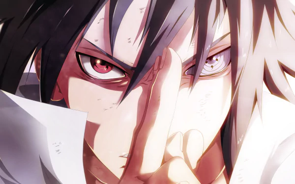 HD desktop wallpaper featuring Sasuke Uchiha from Naruto, showcasing his intense gaze with Sharingan and Rinnegan eyes, and distinctive black hair.