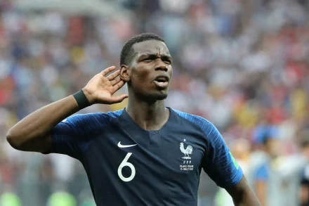 HD desktop wallpaper featuring a focused Paul Pogba in the French national football team jersey, with the number 6, in a stadium setting.