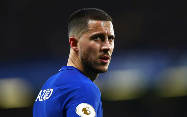Eden Hazard, the talented footballer, is captured in action, showcasing his intensity and skill in this high-definition sports wallpaper.