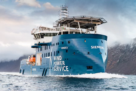 HD desktop wallpaper of the Siemens Windea Offshore Support Vessel at sea, showcasing a modern ship designed for wind power service operations.