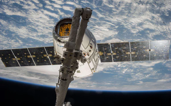 Cargo Dragon spacecraft by SpaceX in HD desktop wallpaper, showcasing advanced technology in space exploration.