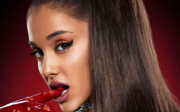 Close-up 4K Ultra HD wallpaper of brunette Latina actress and singer Ariana Grande from Scream Queens, showcasing her brown eyes and signature look.