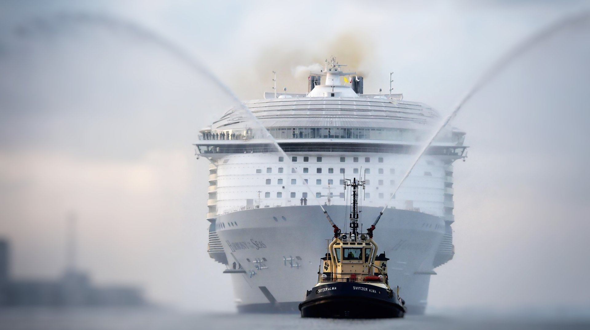 Tugboat guiding a massive cruise ship through misty waters — vehicle and ship scene rendered as a 2K Quad HD PC desktop wallpaper/background.