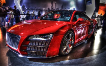 HD desktop wallpaper featuring a striking red Audi R8, showcasing its sleek design and powerful stance, set against a modern backdrop.