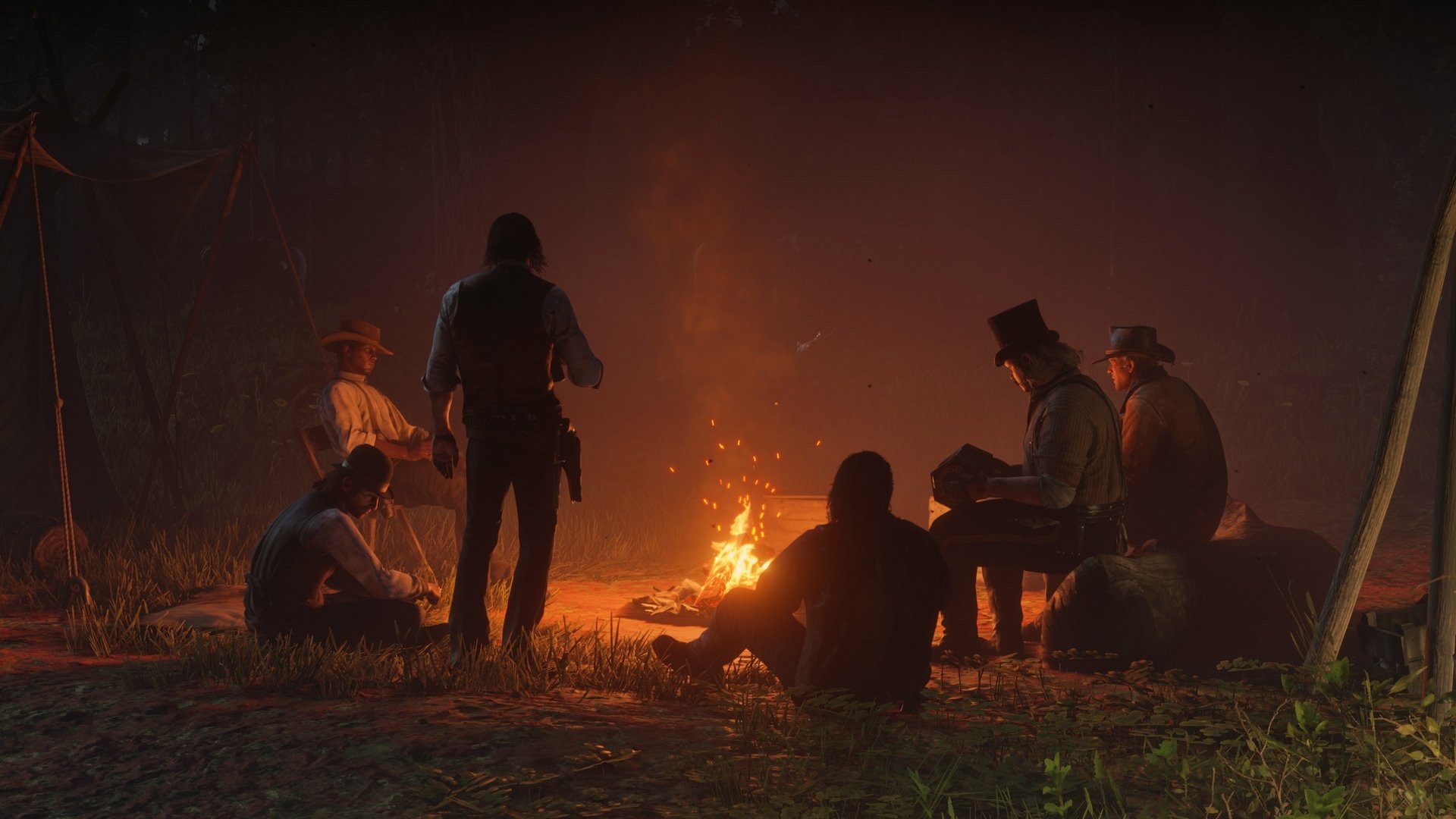 4K Ultra HD PC wallpaper from the video game Red Dead Redemption 2, showing six characters gathered around a campfire in a dark, atmospheric setting.