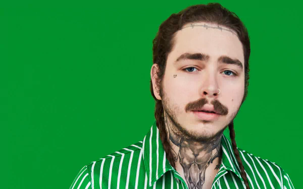 HD wallpaper featuring a man with tattoos and a green-striped shirt against a green background.