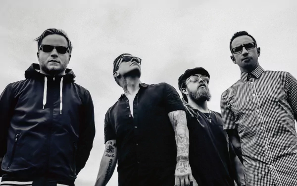 Black and white HD wallpaper featuring the rock band Shinedown, showcasing the four members in stylish attire against a cloudy background, embodying a powerful musical vibe.