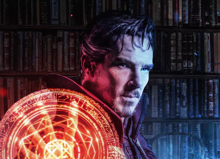 Movie 4K Ultra HD PC desktop wallpaper of Doctor Strange in his cloak, holding a glowing circular spell sigil against a dim library backdrop.