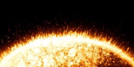 Sci-fi 2K Quad HD PC desktop wallpaper: close-up of a sun's glowing, flaring surface with molten textures and erupting plasma against deep black space.