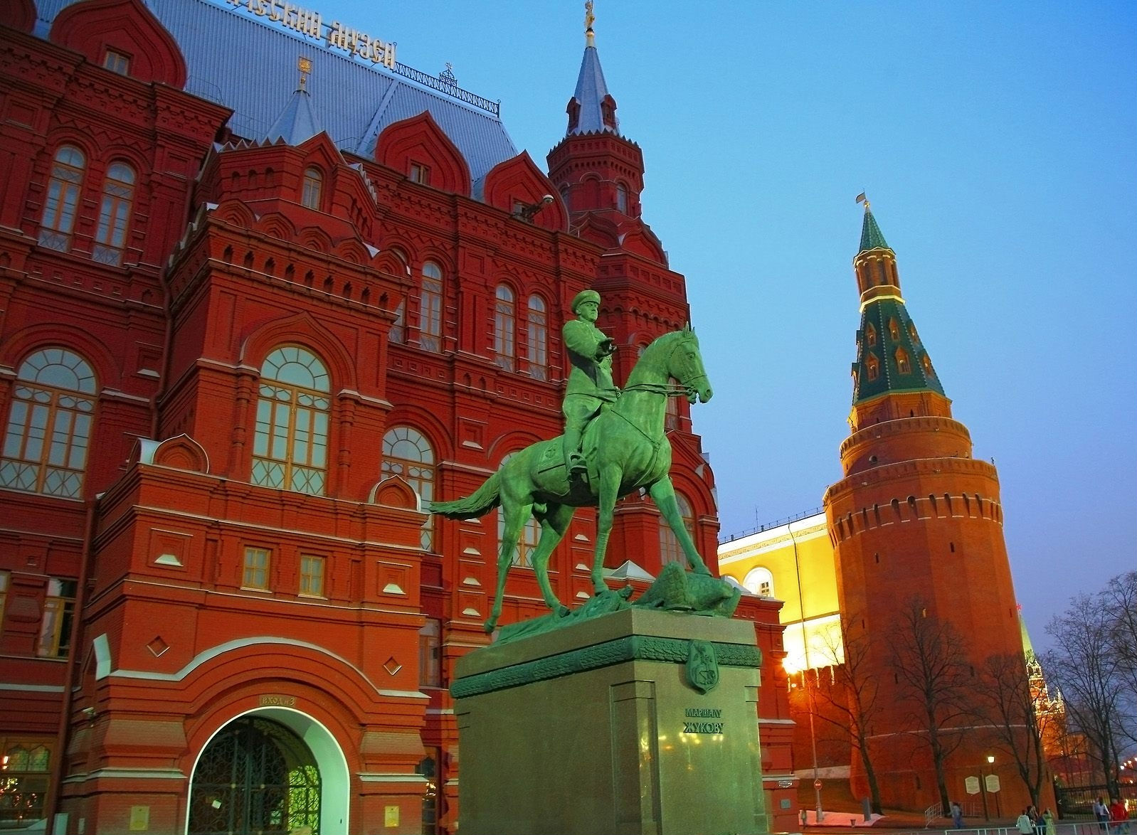 Equestrian statue with State Historical Museum in Moscow, Russia.