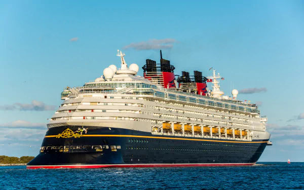 HD PC desktop wallpaper: a large cruise ship (vehicle) gliding on calm blue water beneath a clear sky.