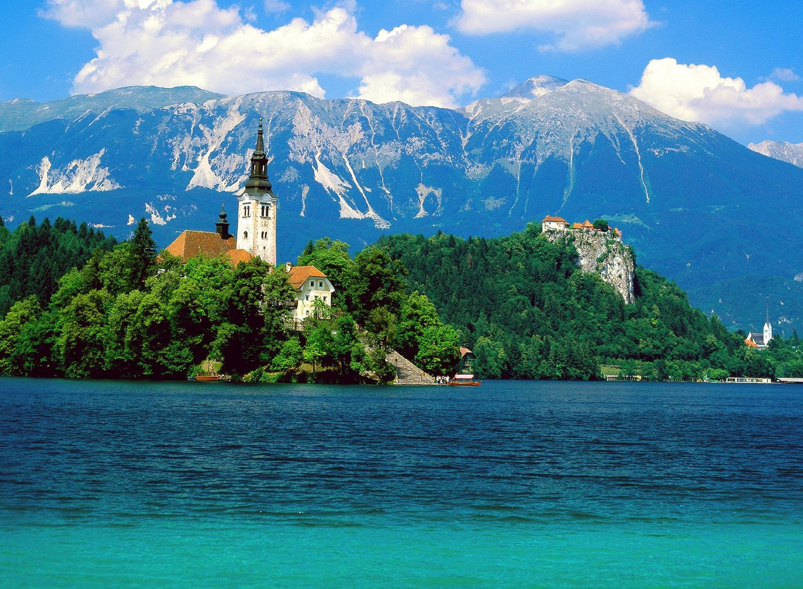 Scenic Lake Bled, Slovenia, offers a picturesque and serene desktop wallpaper option.